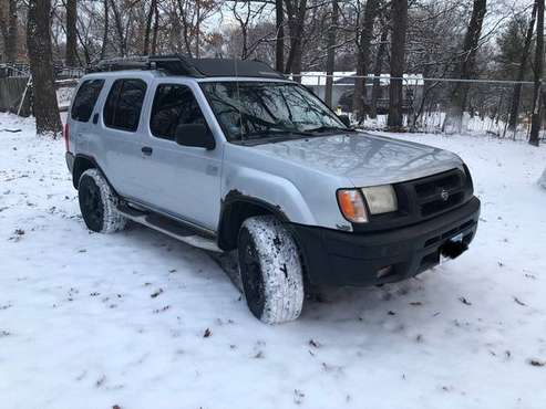 2000 Nissan Xterra 3 3L automatic with four extra tires on rims for sale in Minneapolis, MN