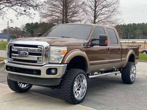 Lifted 11 Ford F-250 lariat 4x4 on 24s clean southern title truck for sale in Easley, SC