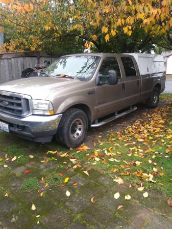 2002 f350 xlt crew cab 7.3 diesel 2wd with work canopy for sale in Tacoma, WA