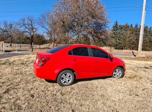 2014 Red Chevy Sonic highway miles for sale in Guthrie, OK – photo 2