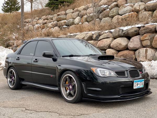 2006 Subaru WRX STI 🚨THIS ONE IS NOT STOCK!🚨 - cars & trucks - by... for sale in Minneapolis, MN
