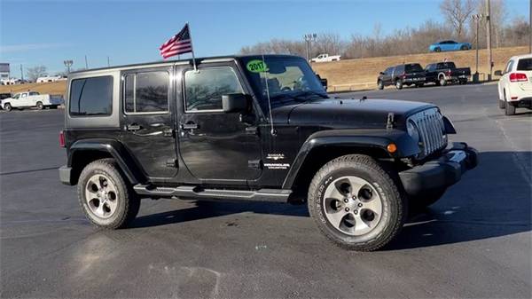 2017 Jeep Wrangler Unlimited Sahara suv Black Clearcoat - cars & for sale in Augusta, KS – photo 2